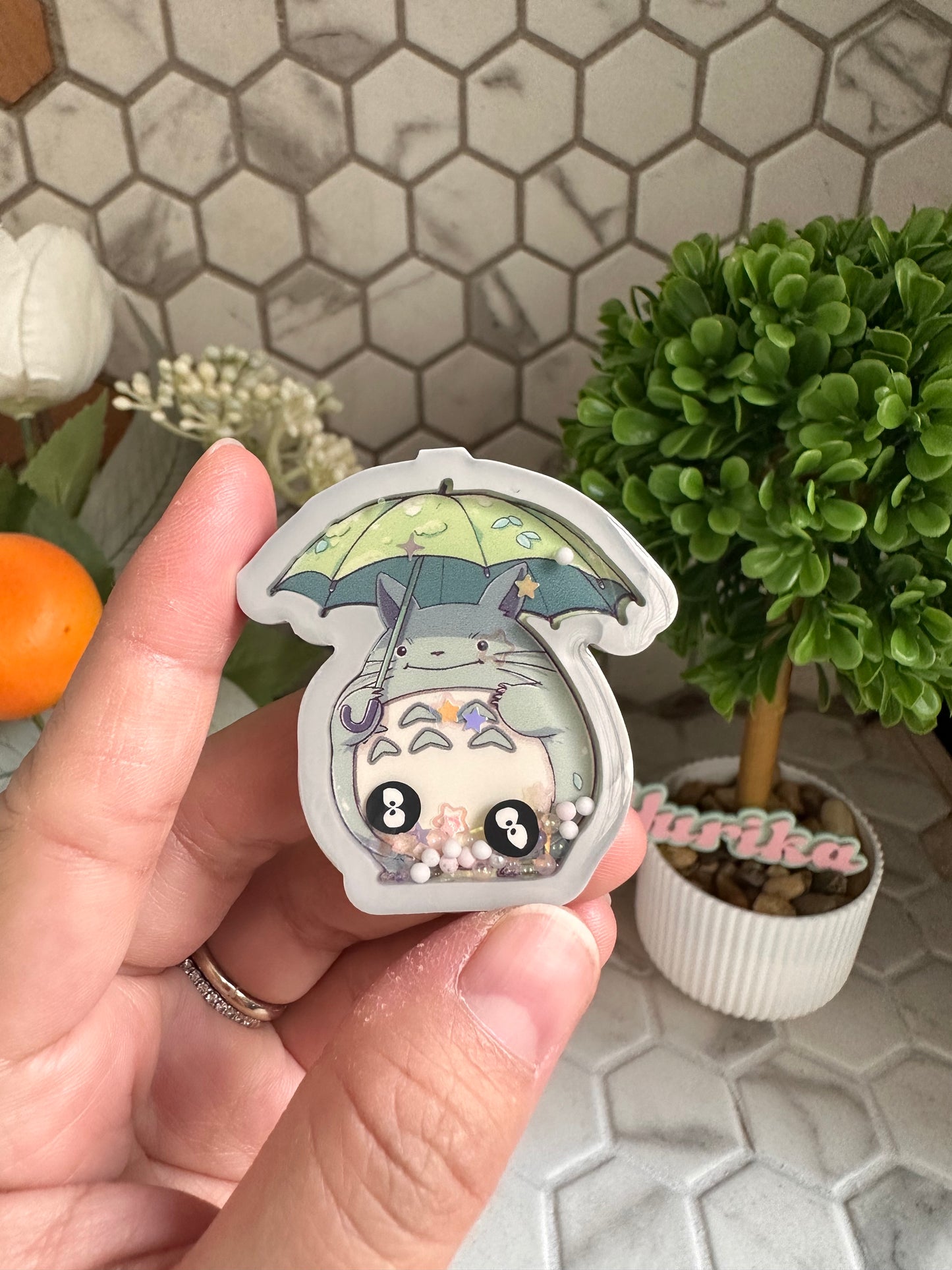 Liquid Shaker: Toto Holding Umbrella